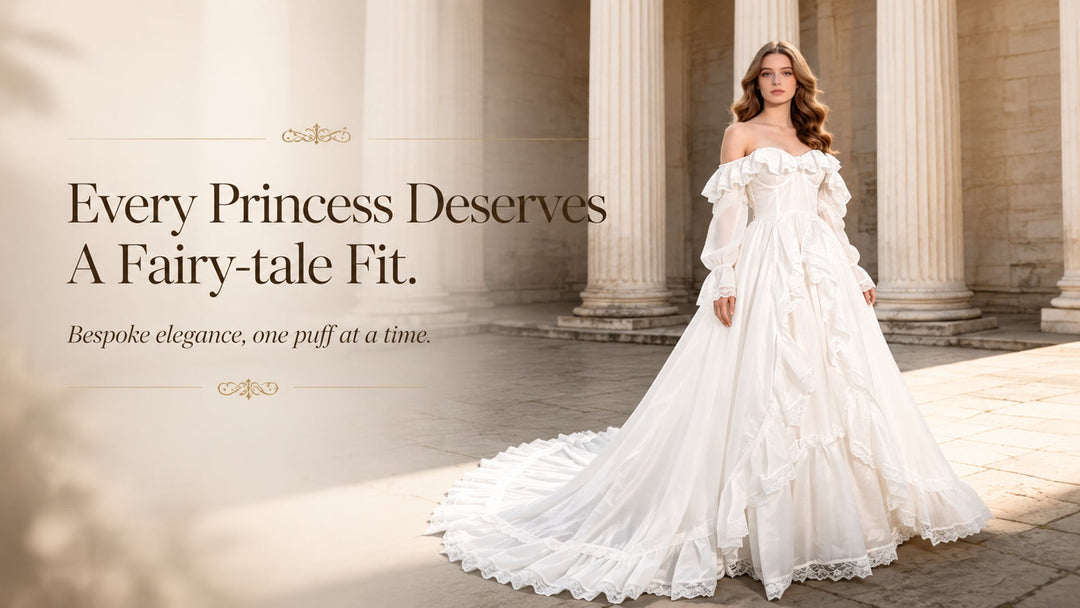 A woman wearing a glamorous white off-the-shoulder princess dress with a long ruffled train, standing in front of classic stone columns.