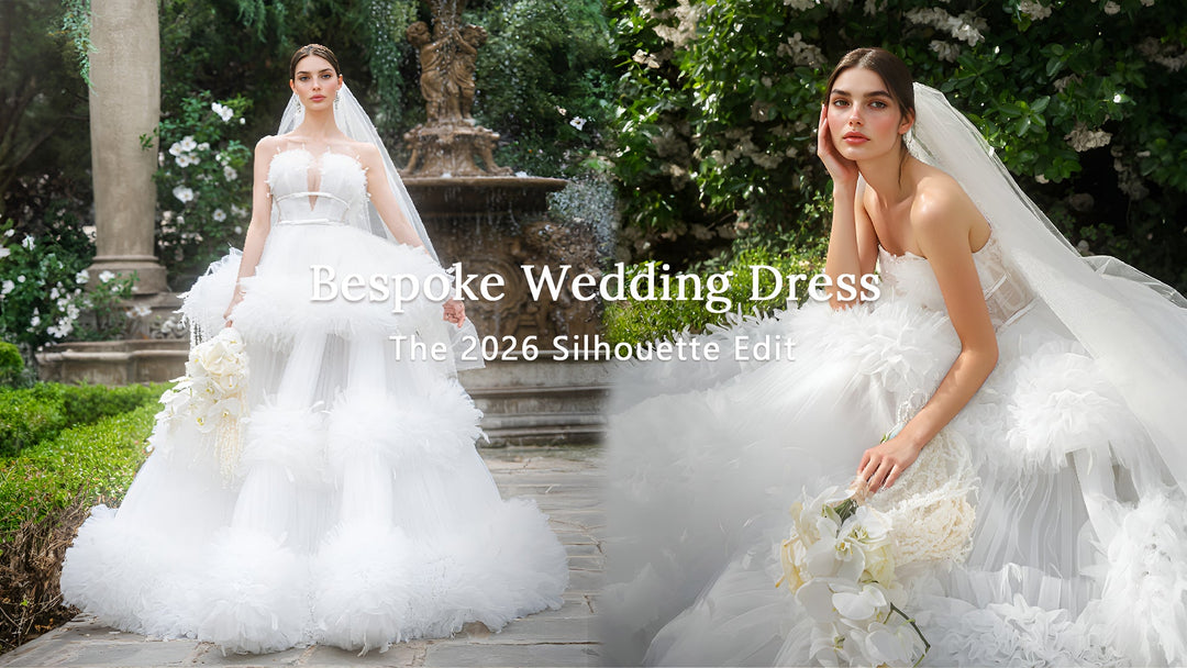 Two models wearing elegant bespoke white wedding dresses posing together in a lush green garden setting.