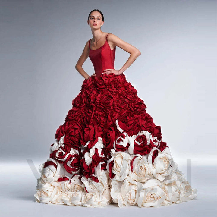 Side view of a model wearing a stunning 3D floral red ball gown with a voluminous skirt.