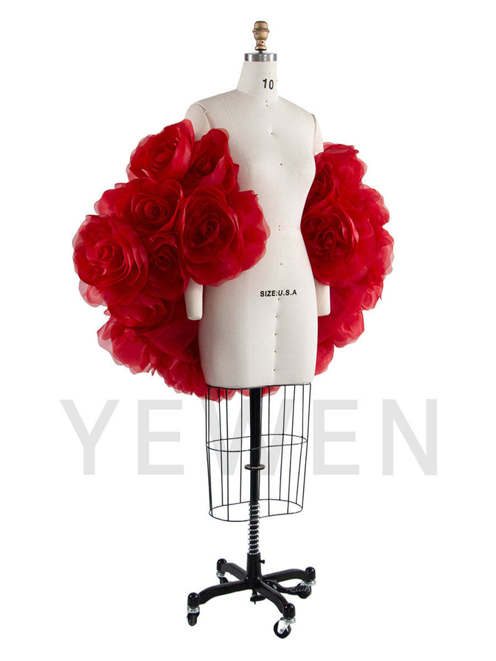 Side view of red 3D flower cape for maternity photoshoot showing flowing elegant structure and floral design
