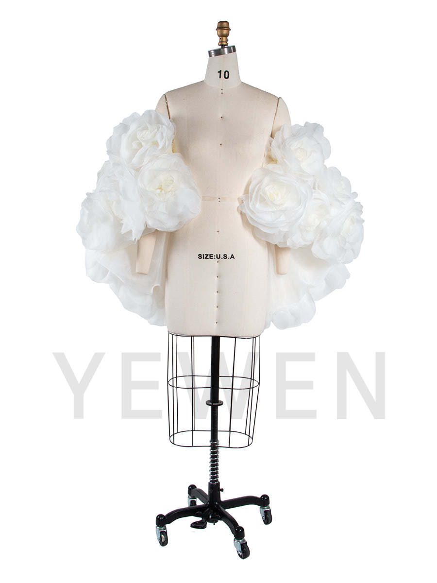 Side view of 3D flower cape for maternity photoshoot showing flowing elegant structure and floral design