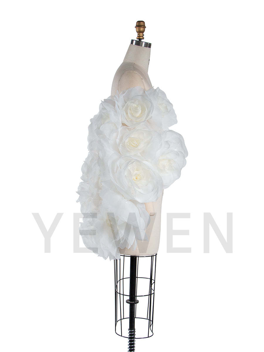 Side view of 3D flower cape for maternity photoshoot showing flowing elegant structure and floral design