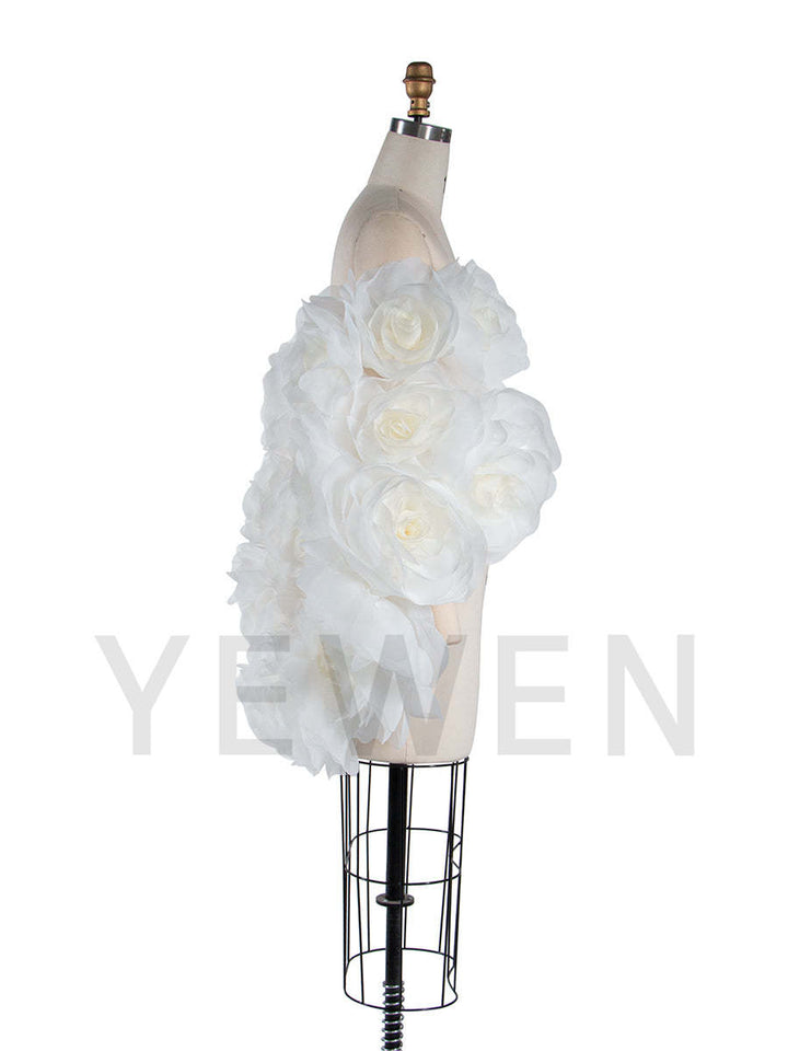 Side view of 3D flower cape for maternity photoshoot showing flowing elegant structure and floral design