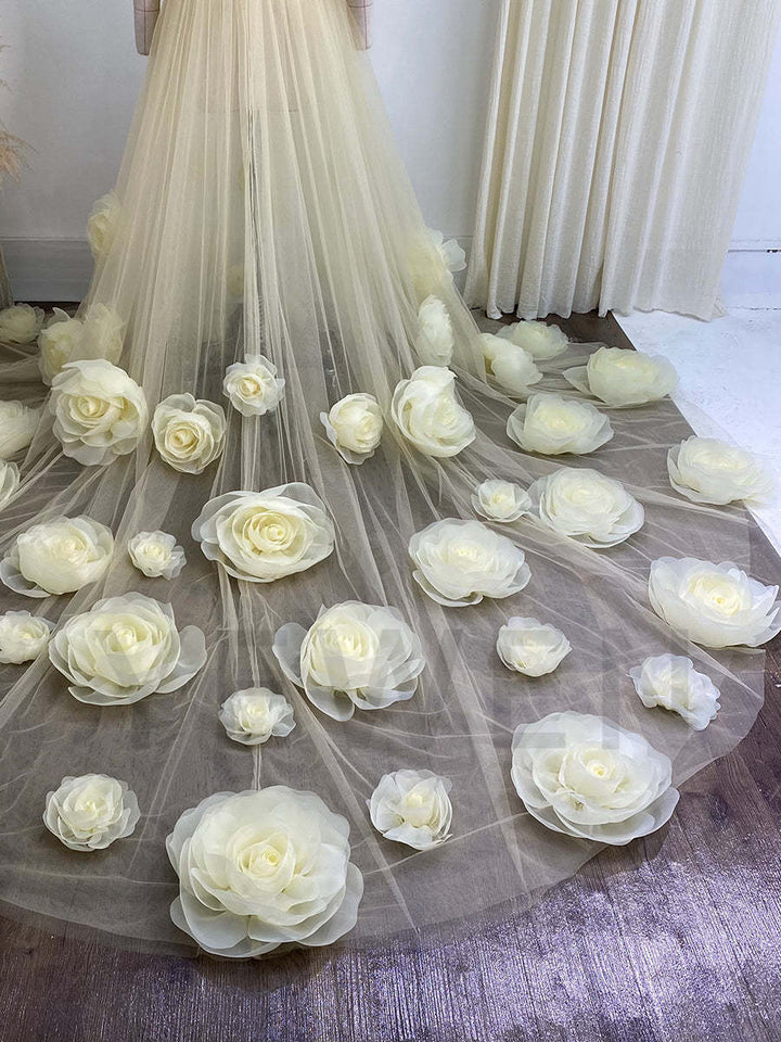 Flowing 3D rose bridal robe captured in motion showing handmade floral movement during photoshoot