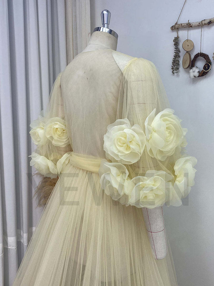 Close-up of handmade 3D rose floral detailing on bridal robe showing luxury craftsmanship and texture