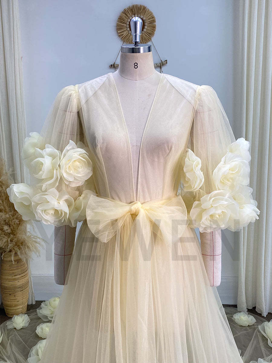 Woman wearing 3D rose bridal robe in elegant boudoir photoshoot studio setting for honeymoon and bridal styling