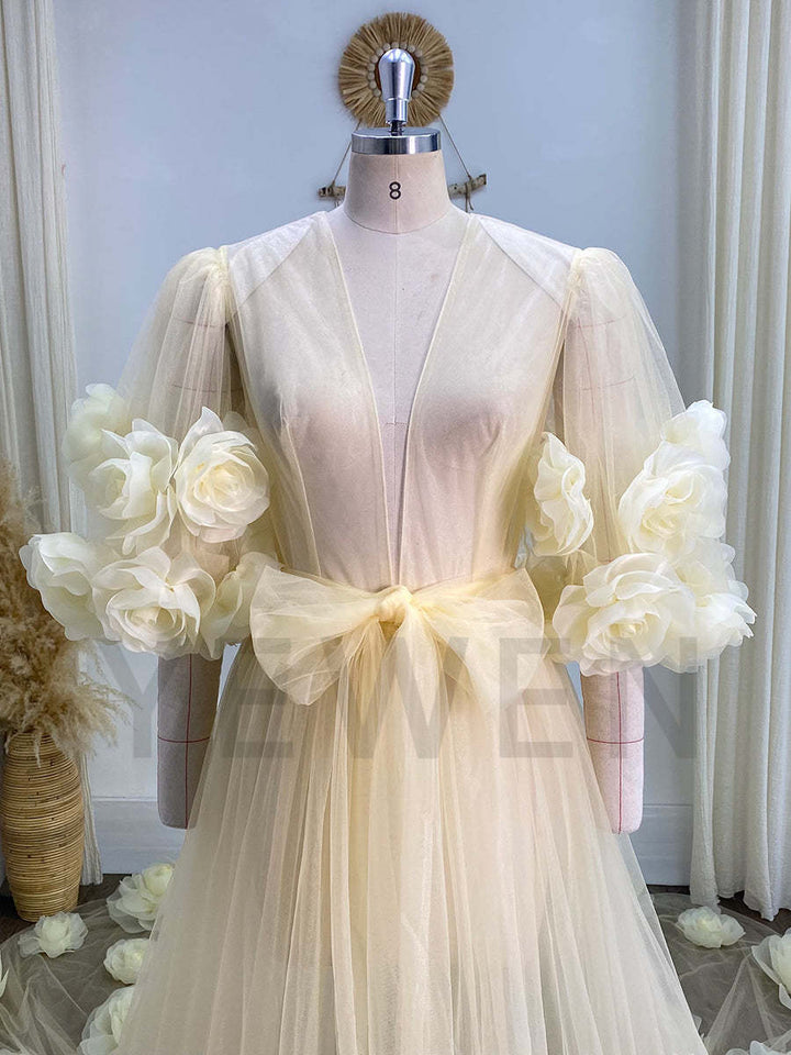 Woman wearing 3D rose bridal robe in elegant boudoir photoshoot studio setting for honeymoon and bridal styling