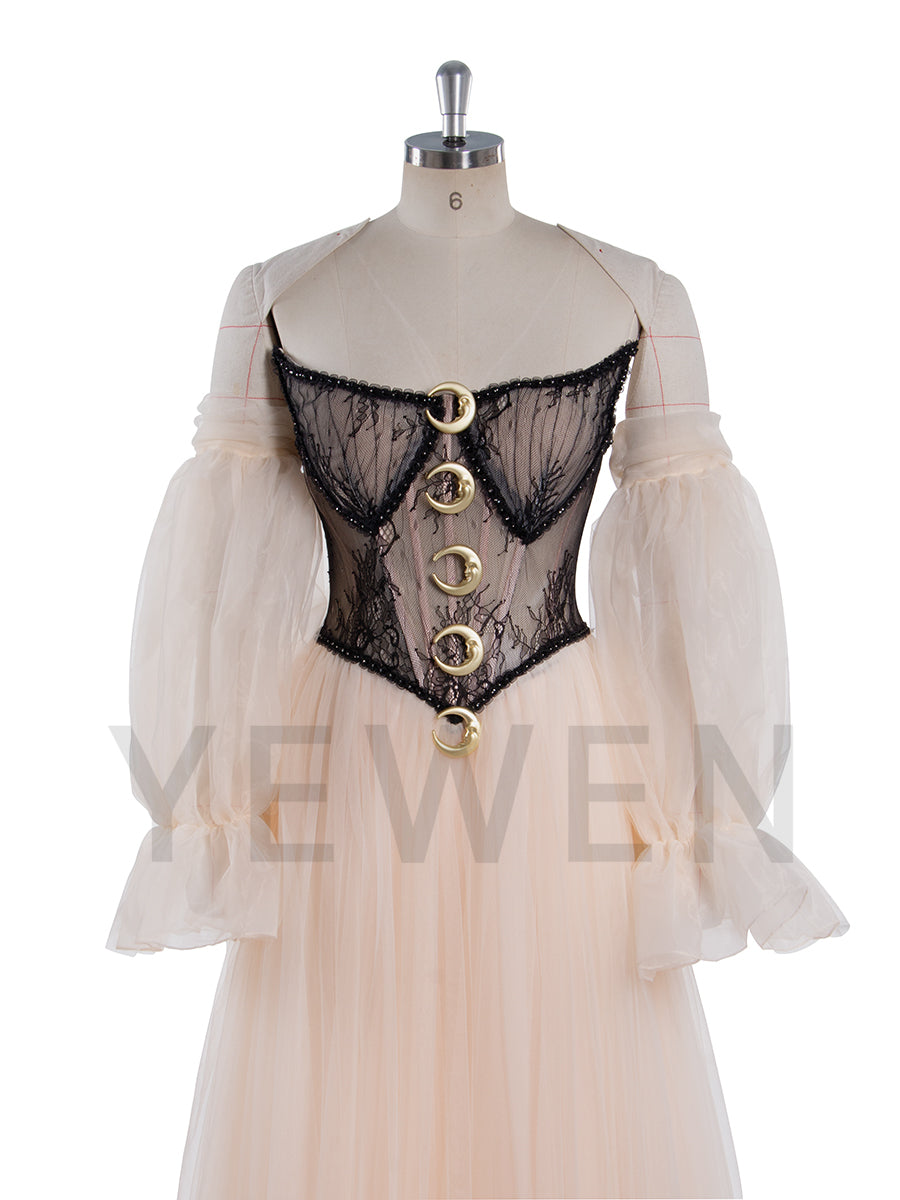 Close-up of corset waist and mesh lace detailing on A-line photoshoot dress showing structured couture craftsmanship