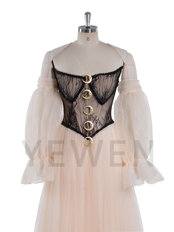 Close-up of corset waist and mesh lace detailing on A-line photoshoot dress showing structured couture craftsmanship