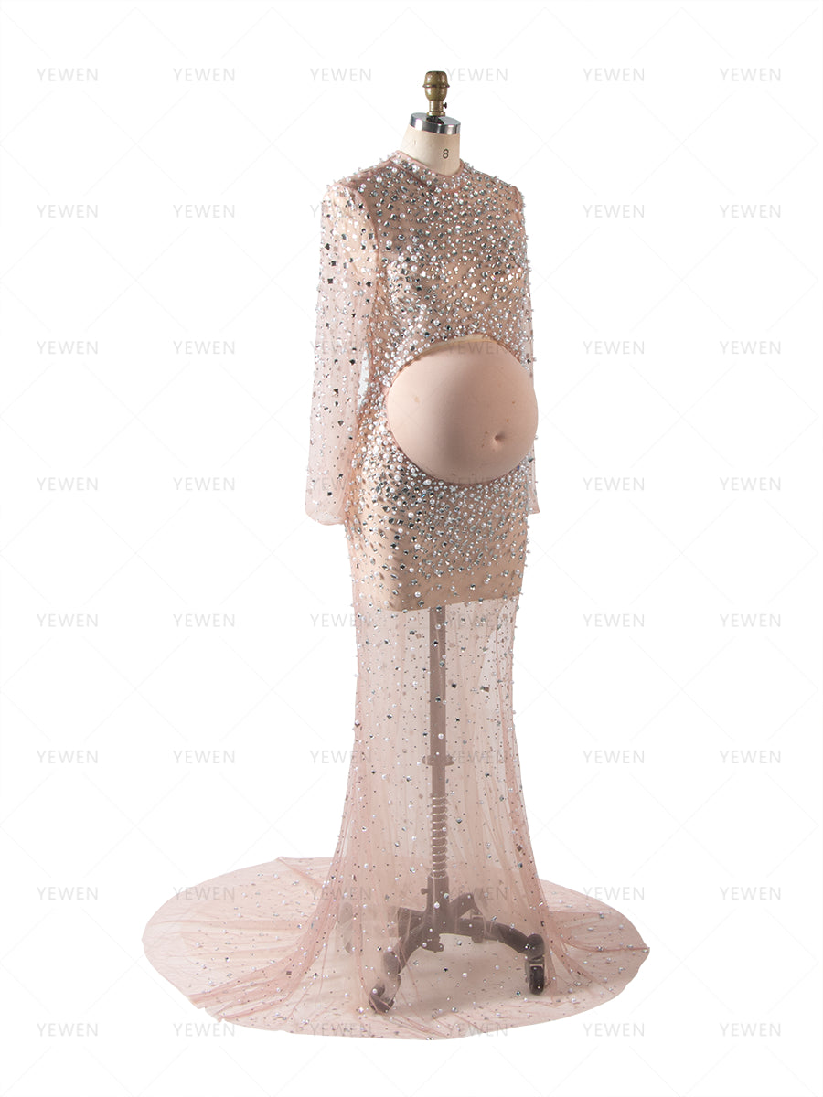 Luxury beaded maternity photoshoot dress styled in soft light for elegant pregnancy editorial photography