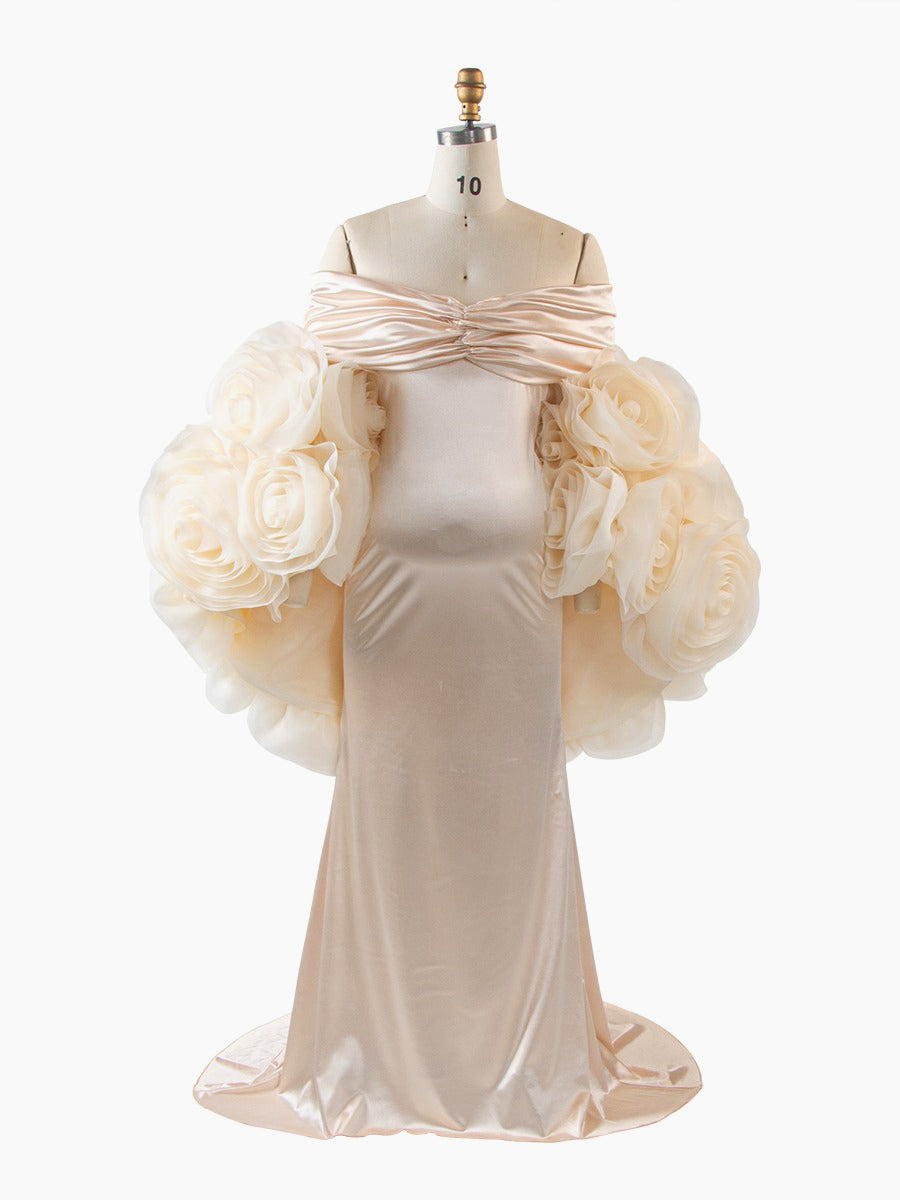 Beige evening gown with floral embellishments on a mannequin against a white background