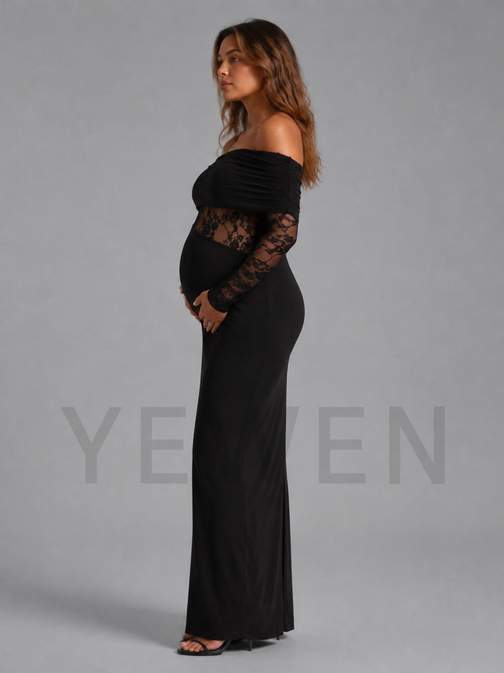 A pregnant woman modeling a black off-the-shoulder maternity maxi dress with long lace sleeves, standing in profile against a solid gray studio background.