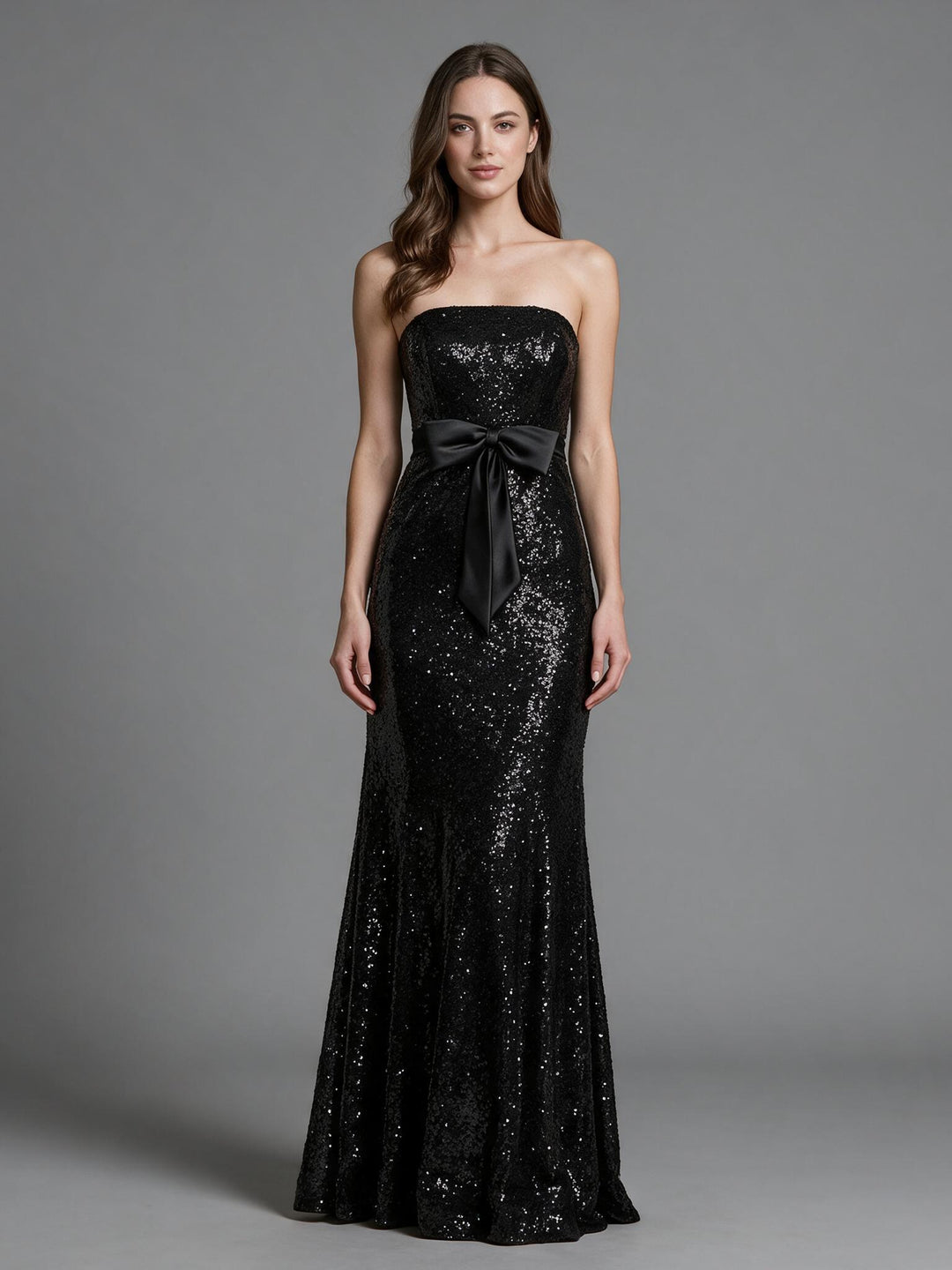 Black sequin strapless bow belt fitted mermaid evening gown, front view.