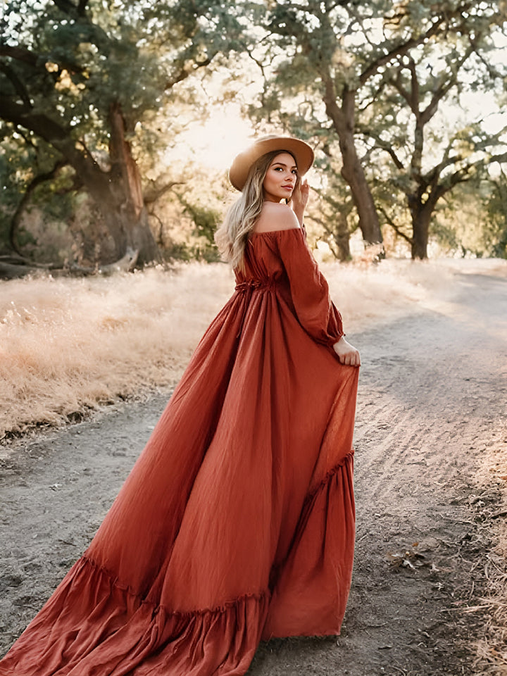Flowing boho maternity photoshoot dress with full sleeves captured in motion during pregnancy photoshoot
