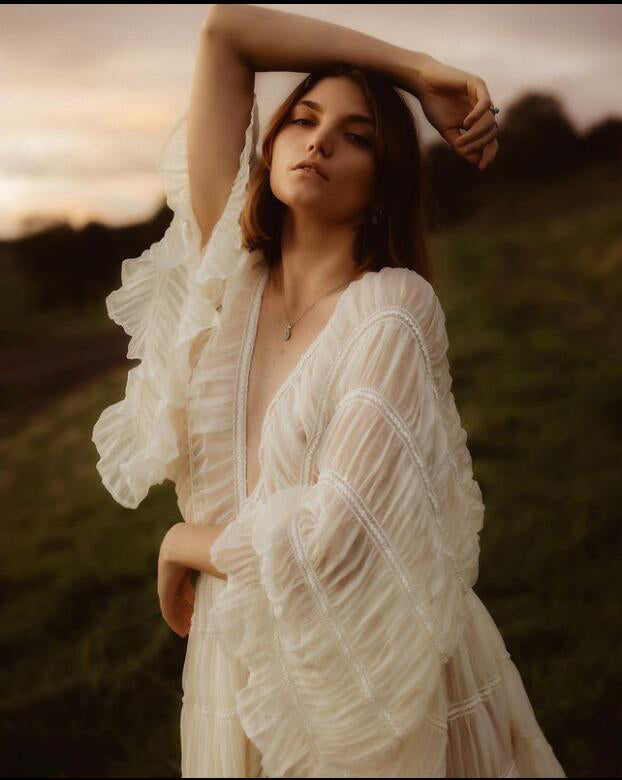 Flowing boho maternity photoshoot dress 2 piece set captured in motion during pregnancy photoshoot