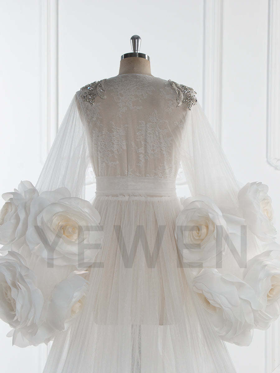 Close-up of 3D floral detailing on bridal photoshoot robe showing luxury handmade craftsmanship
