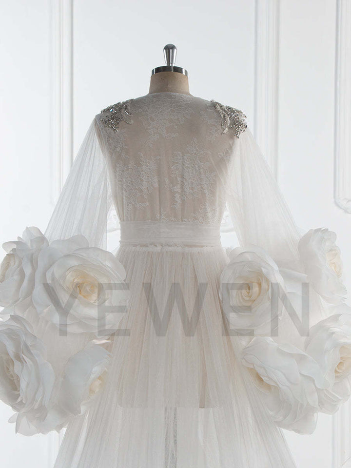 Close-up of 3D floral detailing on bridal photoshoot robe showing luxury handmade craftsmanship