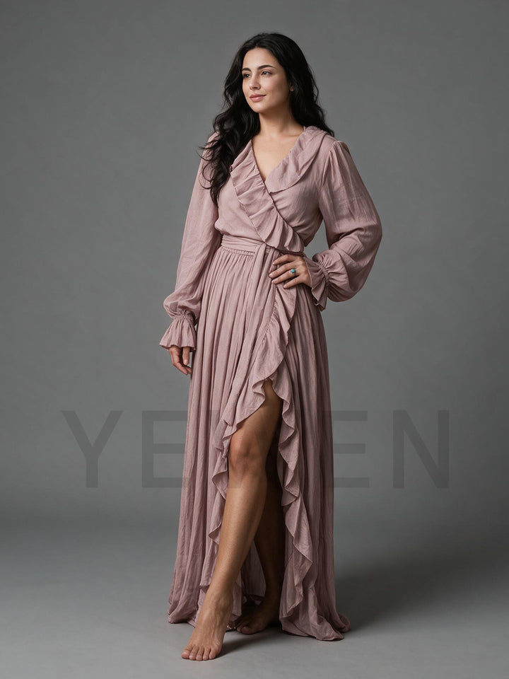 Side profile of a dusty rose cotton linen maxi dress showing the high side slit and sash belt.