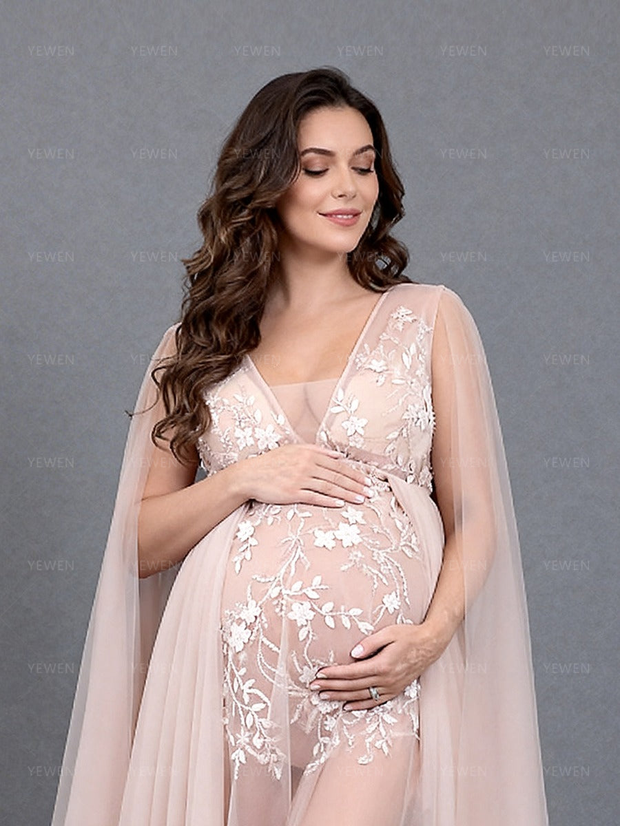 Close-up front view of a pregnant model wearing a custom maternity photography gown highlighting the V-neck and beads appliques.