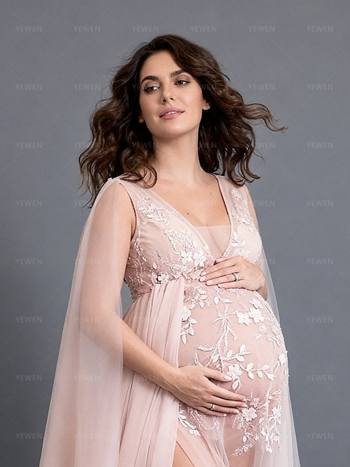 Close-up side view of a pregnant model wearing a custom maternity photography gown highlighting the sheer tulle and beads details.