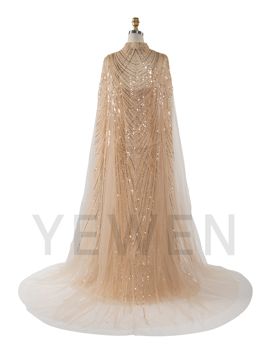 Back view of luxury evening dress with cape and hand-beaded detailing designed for special events