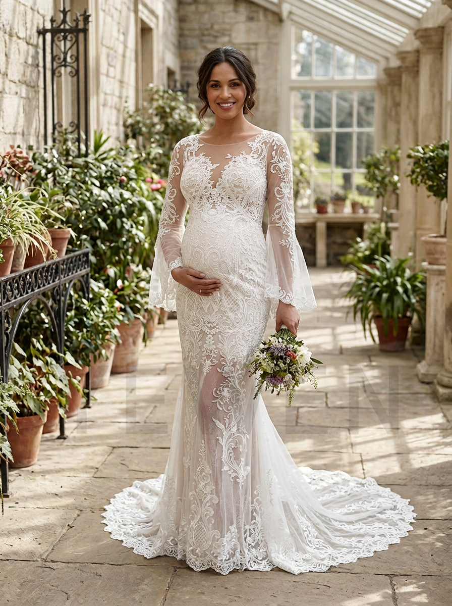 A pregnant woman wearing a white lace mermaid wedding dress with long sheer bell sleeves stands in a sunlit stone conservatory with potted plants and holding a small bouquet.