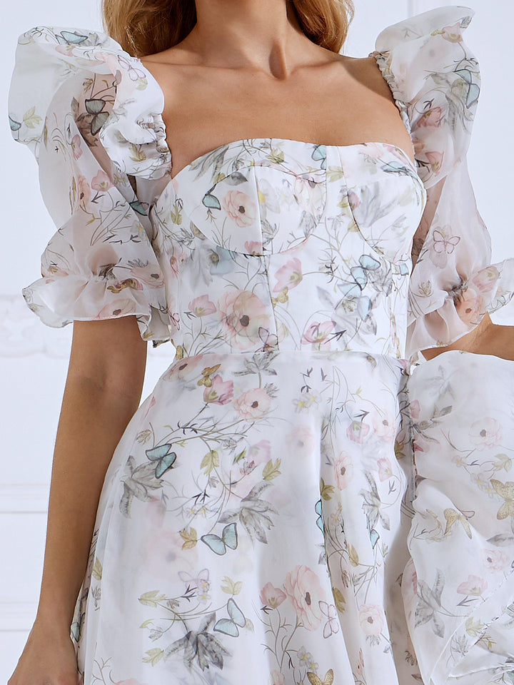 Close-up of floral print details on floral fairy dress showing delicate patterns and elegant fabric texture