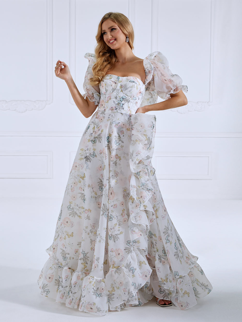Front view of floral fairy dress featuring floral printing, short sleeves, and a romantic floor length silhouette