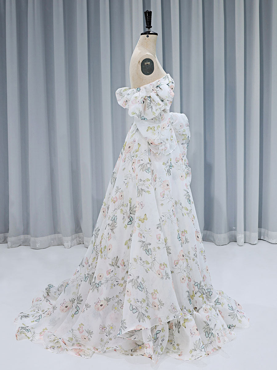Side view of floral fairy dress showing flowing floor length skirt and elegant floral print details