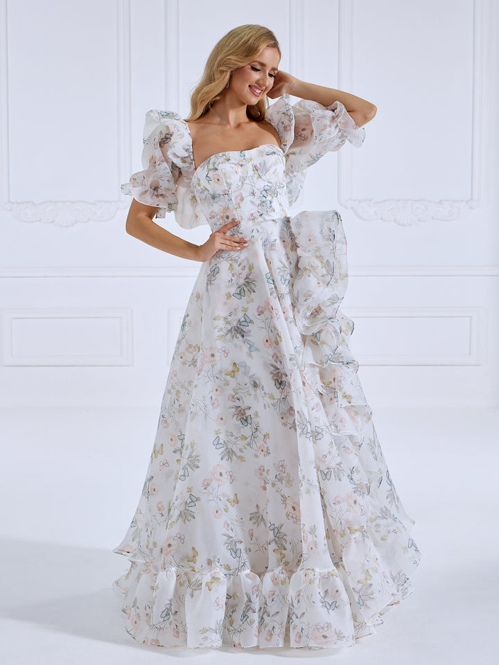 Front view of floral fairy dress featuring floral printing, short sleeves, and a romantic floor length silhouette