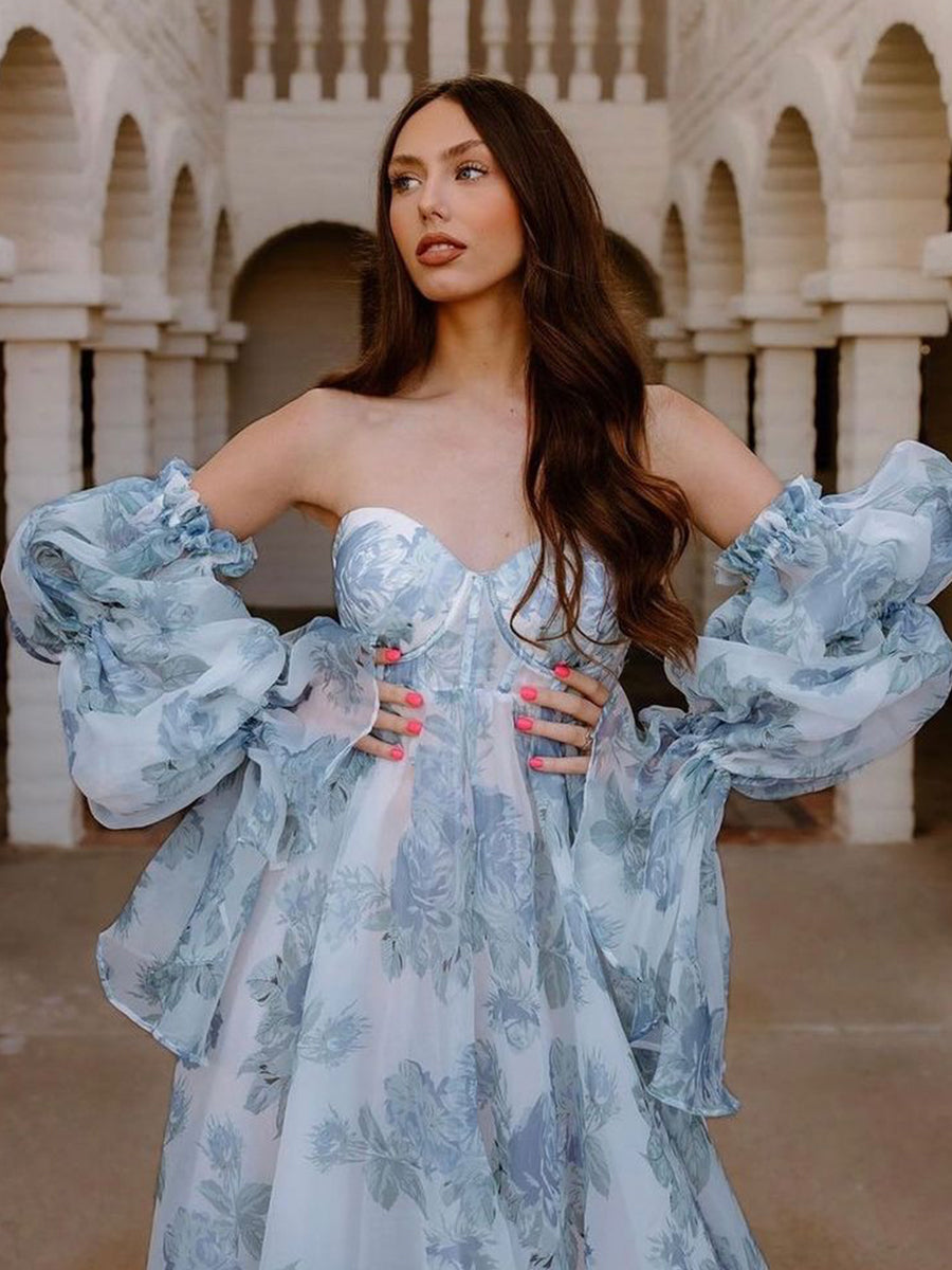 Romantic blue floral maternity dress for photoshoot styled in soft light for elegant pregnancy photography