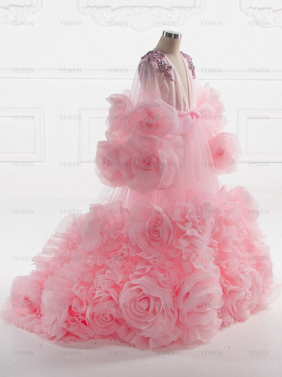 Side view of flower girl dress showing layered organza skirt and three dimensional floral embellishments