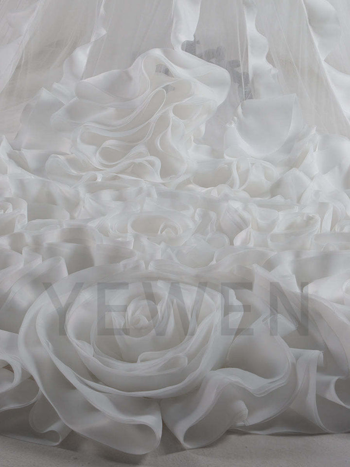Close-up of organza ruffles detail on flower photo shoot dress showing soft texture and luxury craftsmanship