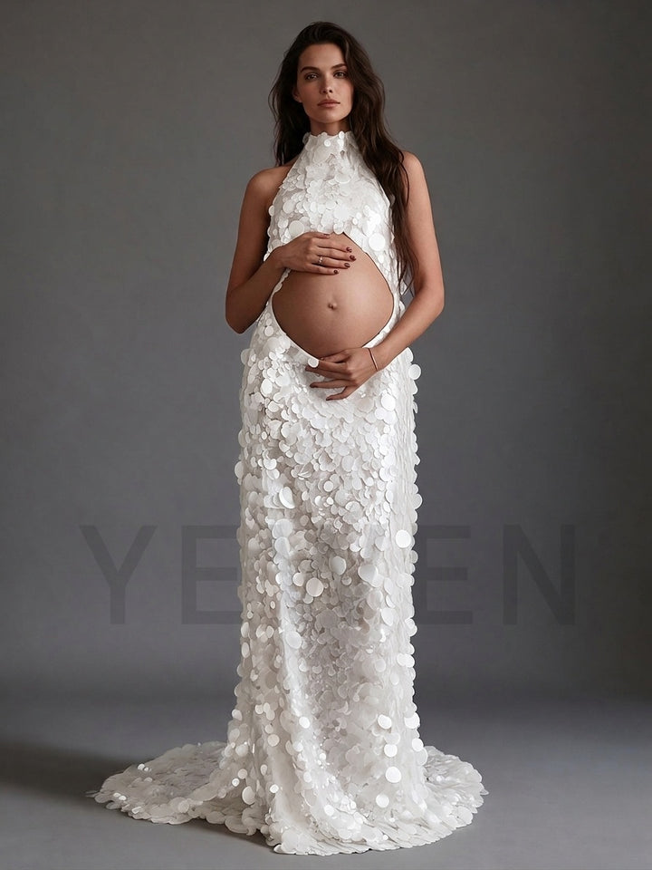 Front view of a white sequin maternity gown with a halter neck.