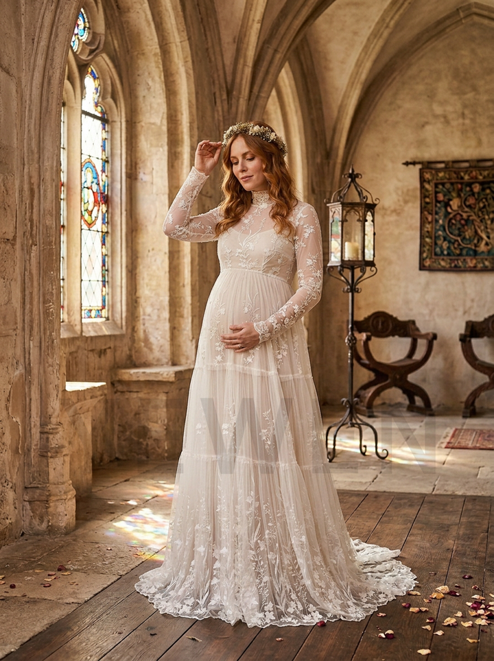 A pregnant woman wearing a long-sleeved lace wedding gown stands in a sunlit stone chapel with arched ceilings, stained glass windows, and wooden floors.