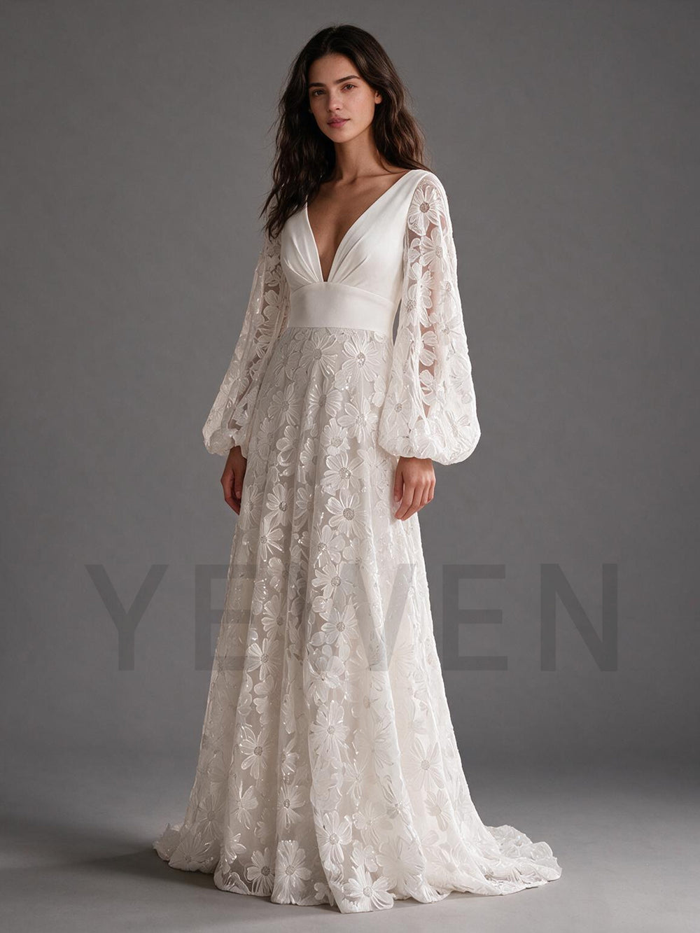 Back view of an ivory floral lace boho wedding dress featuring a deep V-back and long sleeves.