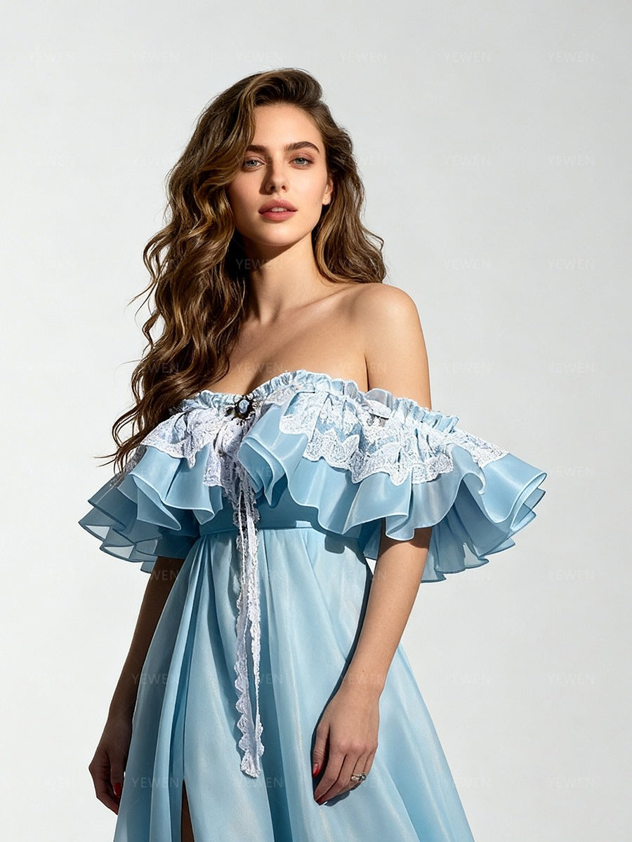 Close-up front view of a model wearing a light blue off-shoulder ruffle high slit long dress highlighting the sweetheart neckline.