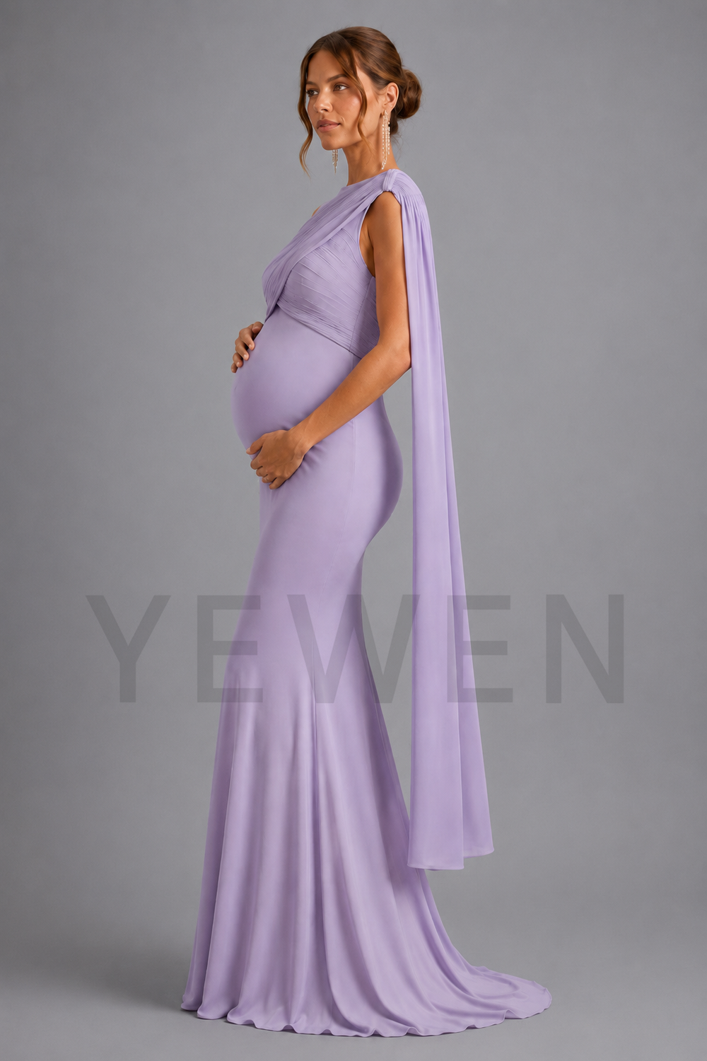 A pregnant woman modeling a lavender one-shoulder floor-length gown with a draped capelet, standing against a solid gray studio background. A faint 'YEWEN' brand watermark is visible across the lower portion of the image.