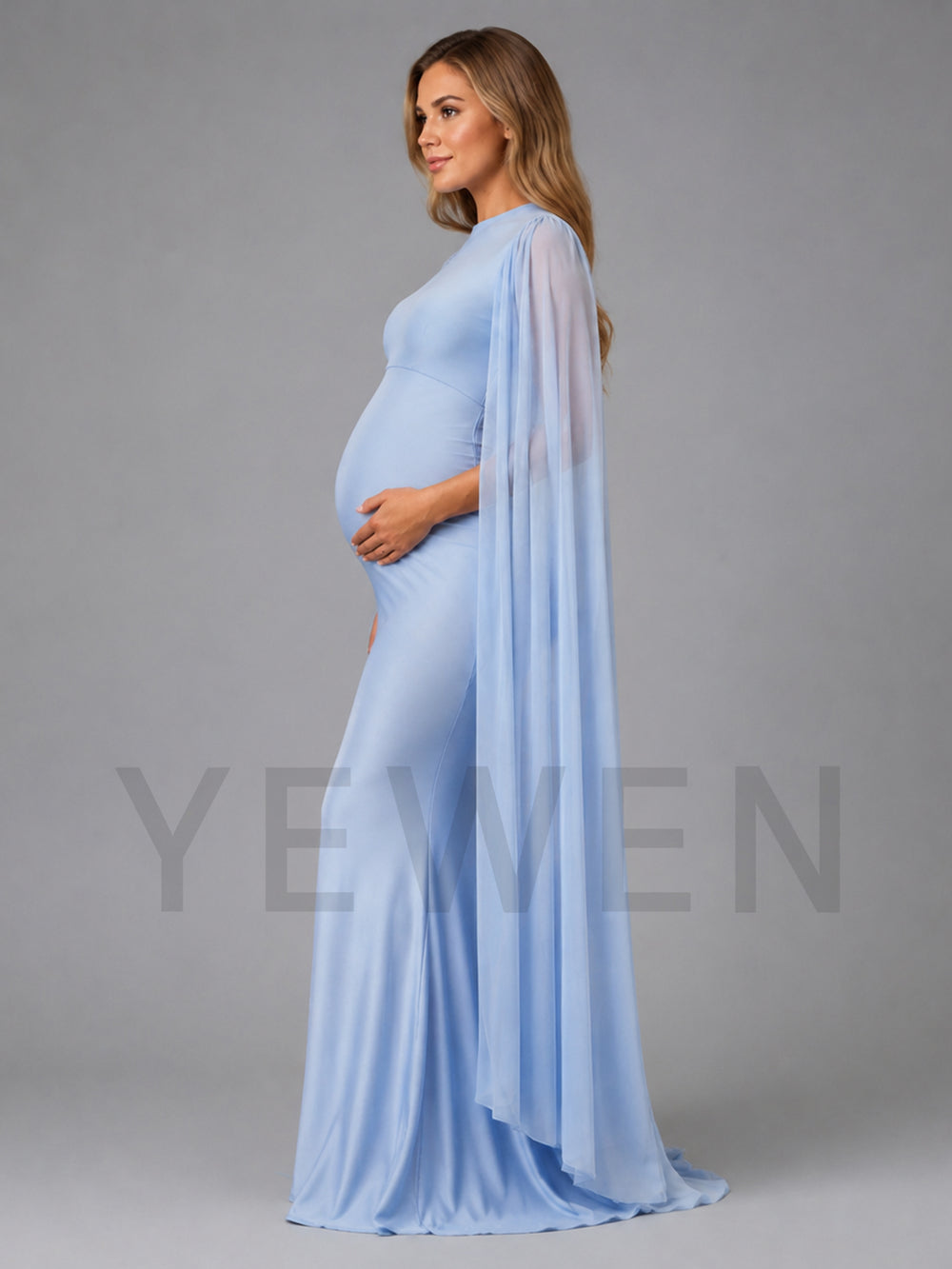 A pregnant woman wearing a light blue maternity gown with a sheer draped cape overlay, standing in profile against a solid gray studio background. A large semi-transparent watermark reading 'YEWEN' is overlaid across the center.