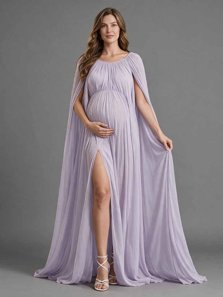 Lavender chiffon maternity photoshoot gown with a dramatic cape sleeve and high slit, front view.
