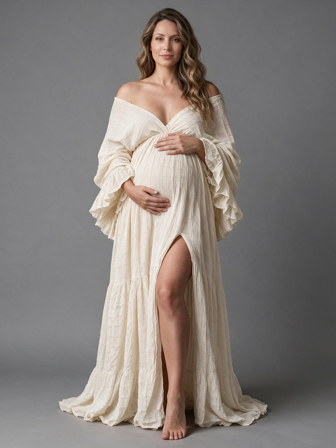 Front view of an off-shoulder ruffle sleeve maternity gown for photoshoot.