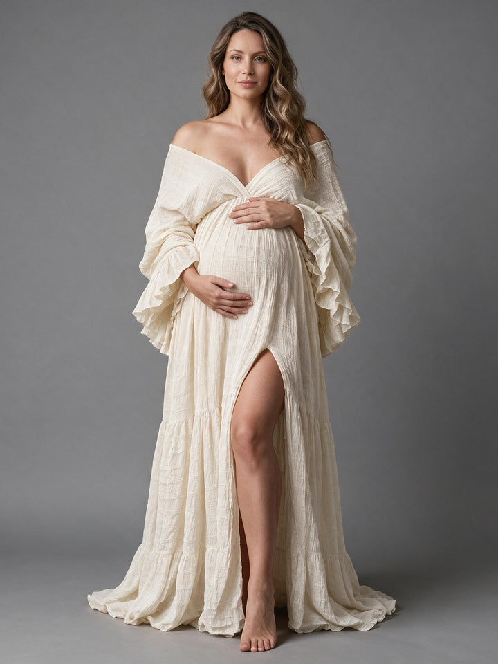 Front view of an off-shoulder ruffle sleeve maternity gown for photoshoot.