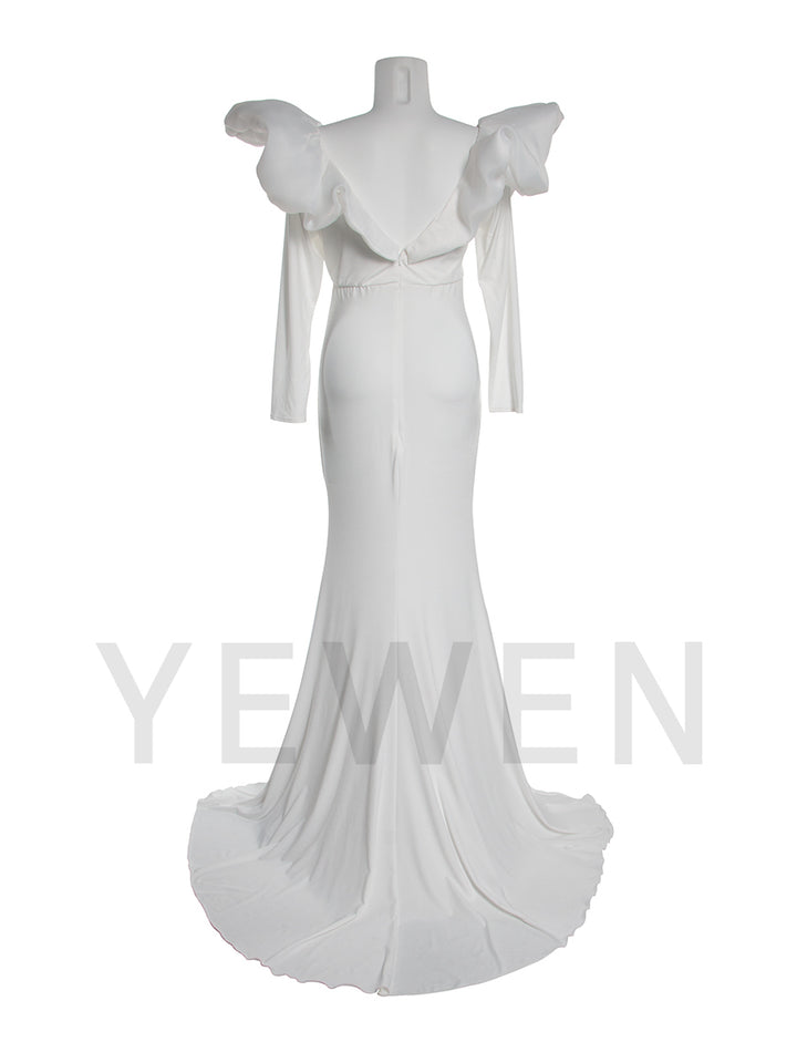Back view of a maternity wedding gown with bow shoulder details and mermaid silhouette displayed on a mannequin.