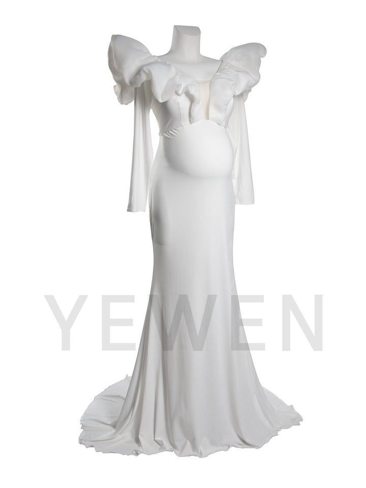 Side view of a maternity wedding gown with mermaid silhouette and bow shoulder details displayed on a mannequin.