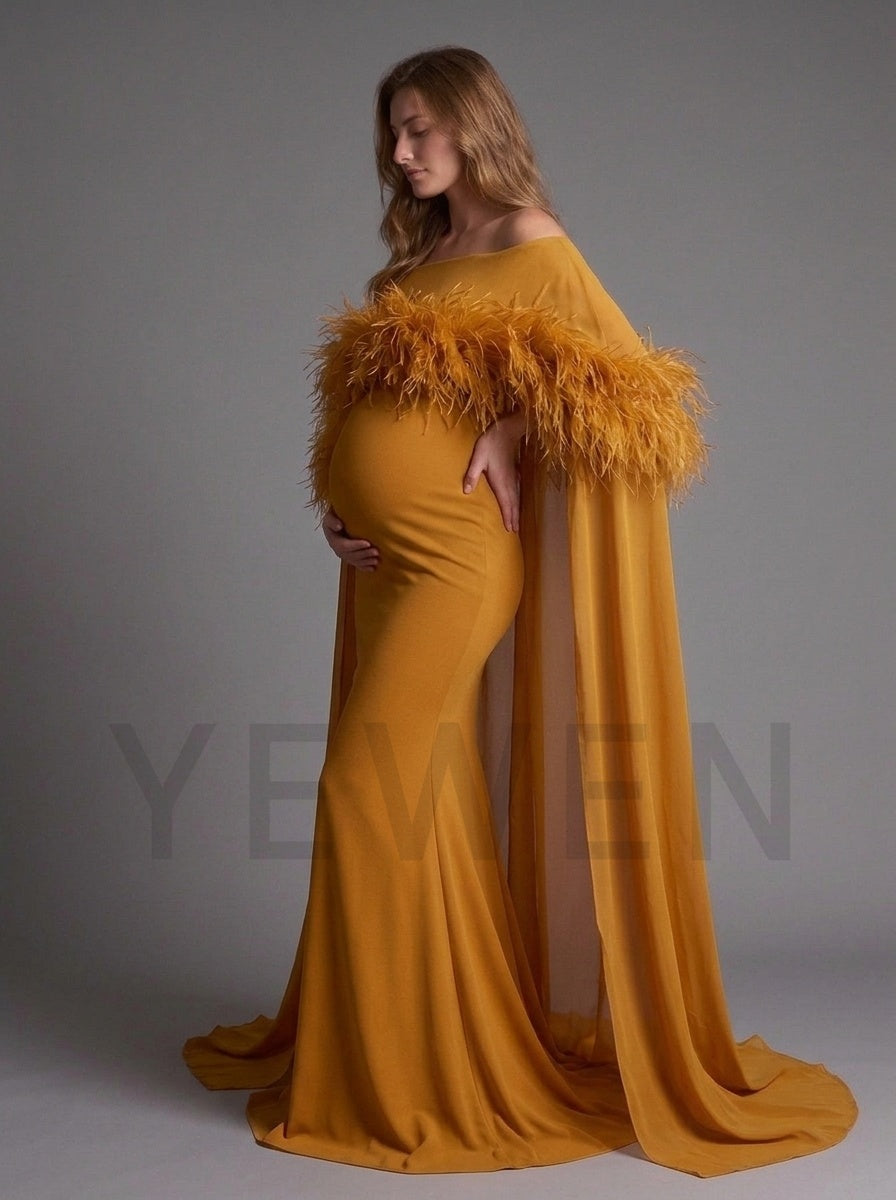 Side profile of a caramel off-shoulder pregnancy dress with a faux fur trim cape.
