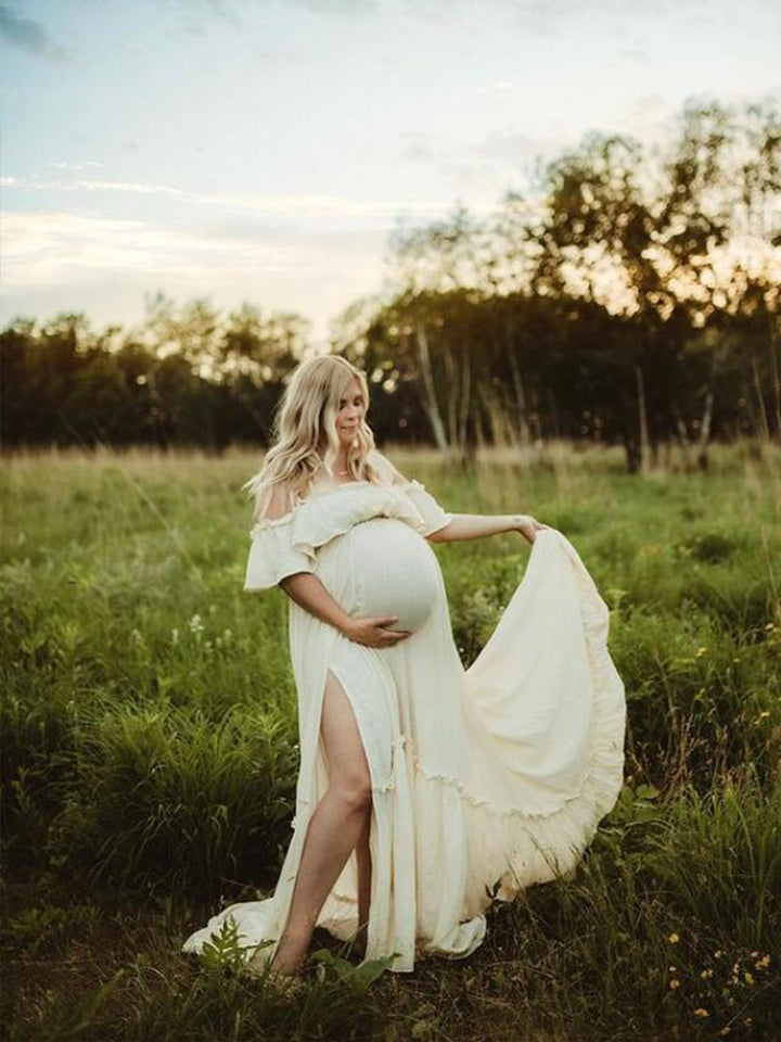 Elegant off shoulder maternity dress for photo shoot styled in soft light for romantic pregnancy photography