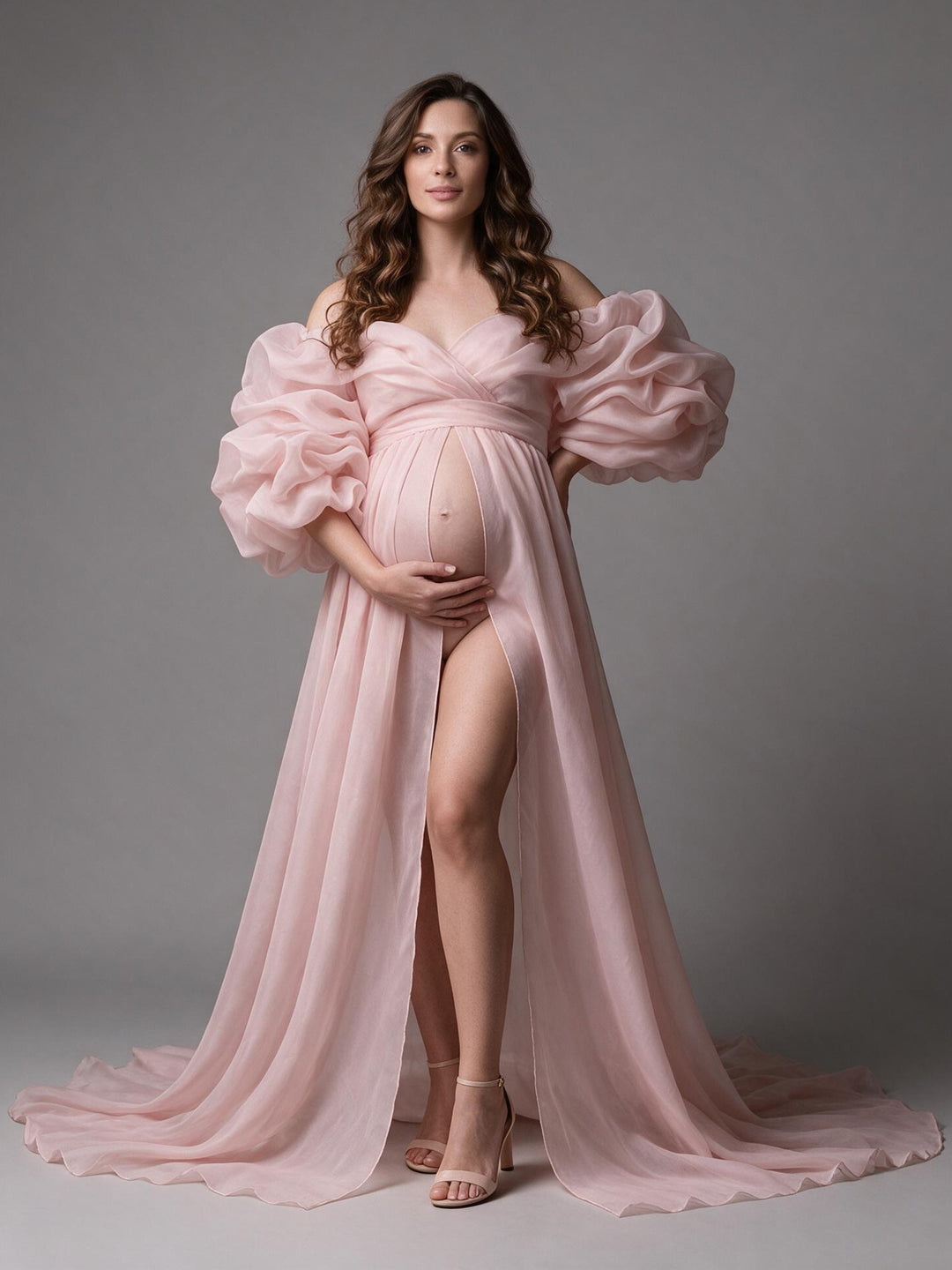 Blush pink organza maternity photoshoot gown with puff sleeves and a high slit, front view.