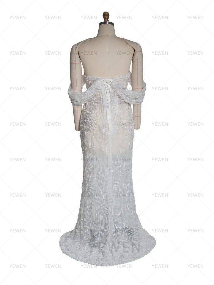 Back view of elegant pearl maternity gown designed for professional photography and baby shower photoshoots