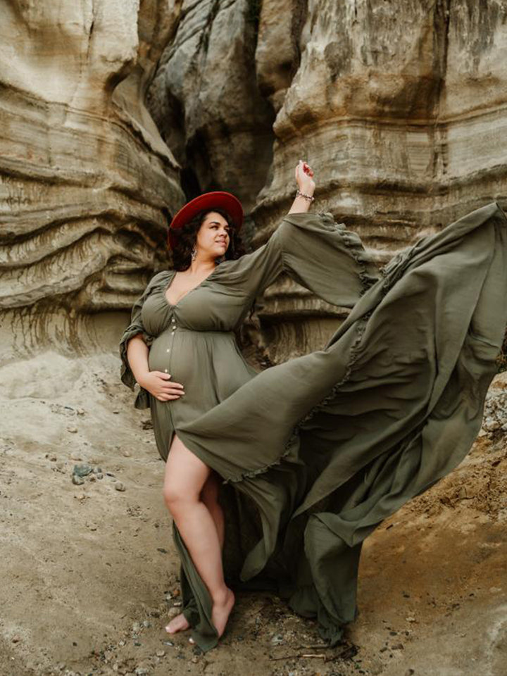 Flowing photography dress captured in motion during elegant maternity photoshoot