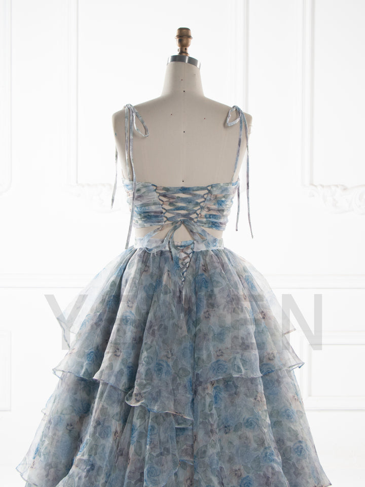 Back close up of photoshoot gown featuring layered ruffle details and elegant finishing